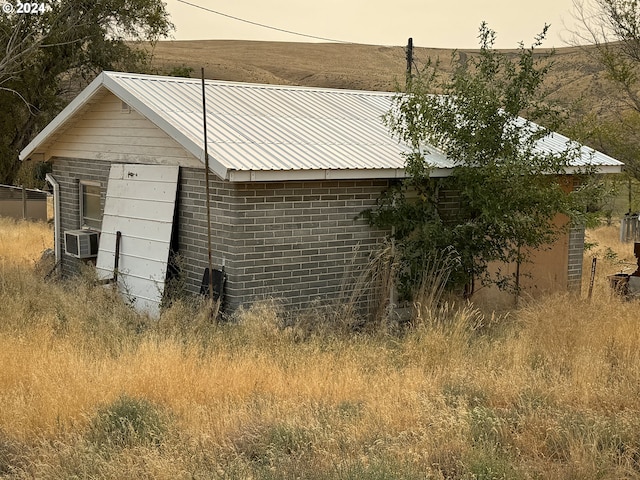 view of property exterior at dusk