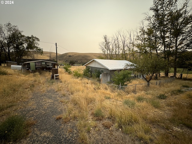 exterior space featuring a rural view and a mountain view