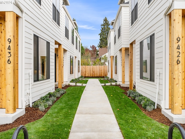 view of side of home featuring a yard