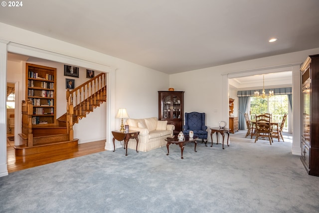 living area featuring an inviting chandelier, stairway, carpet flooring, and recessed lighting