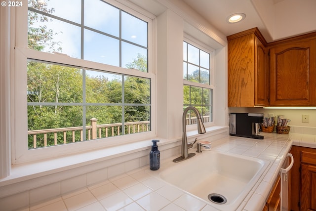 interior space featuring recessed lighting and a sink