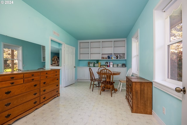 dining space featuring light floors, baseboards, and visible vents