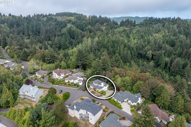 bird's eye view with a residential view and a wooded view