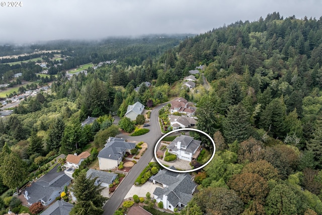 aerial view with a forest view and a residential view