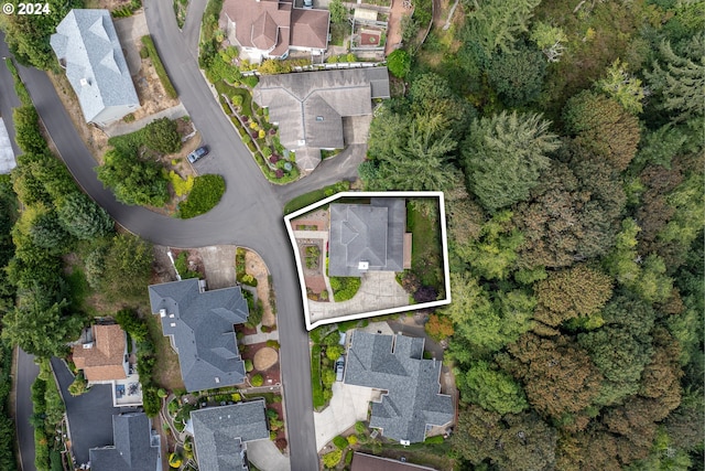 birds eye view of property with a residential view