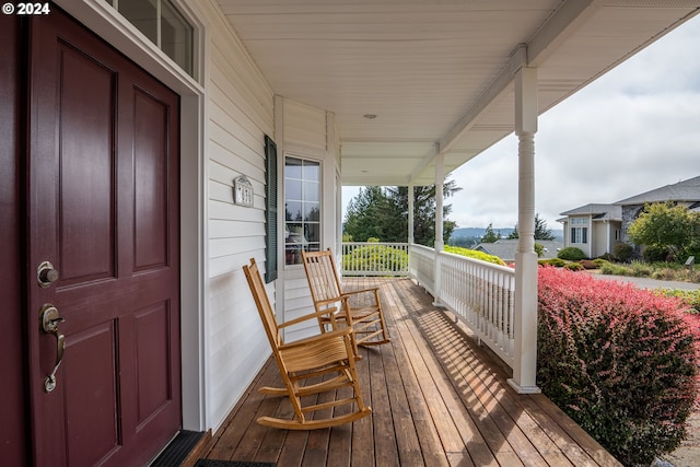 wooden deck featuring covered porch