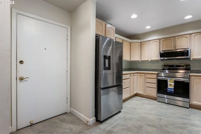 kitchen featuring light brown cabinetry and appliances with stainless steel finishes