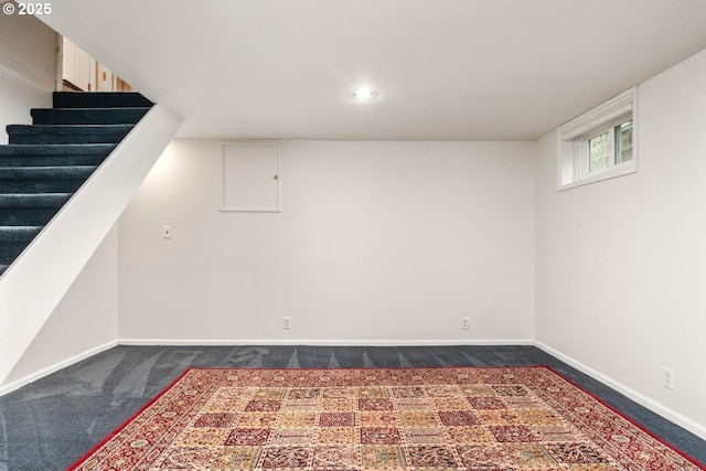 basement with dark carpet