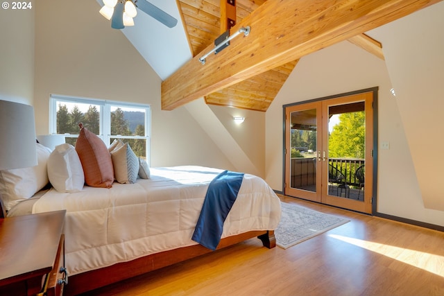 bedroom with ceiling fan, beamed ceiling, french doors, wood-type flooring, and access to exterior