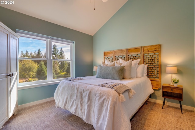 bedroom with light carpet and high vaulted ceiling