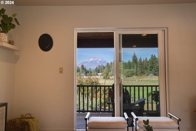 entryway featuring a mountain view and a wealth of natural light