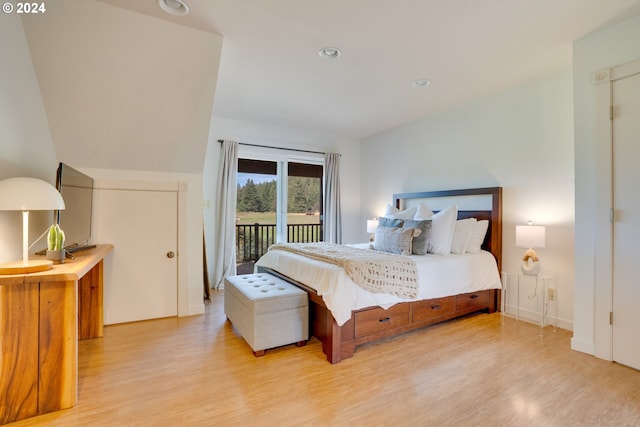 bedroom with light hardwood / wood-style floors and access to exterior