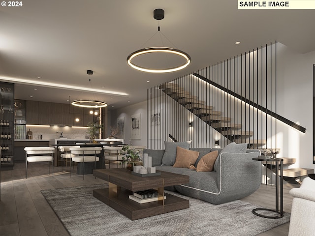 living room featuring an inviting chandelier and hardwood / wood-style flooring