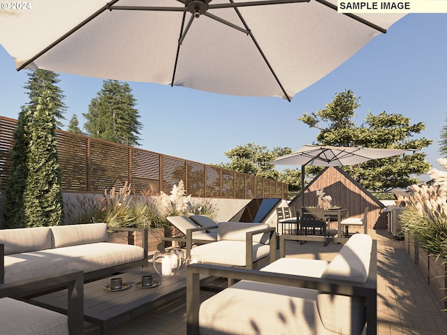 wooden deck featuring an outdoor hangout area