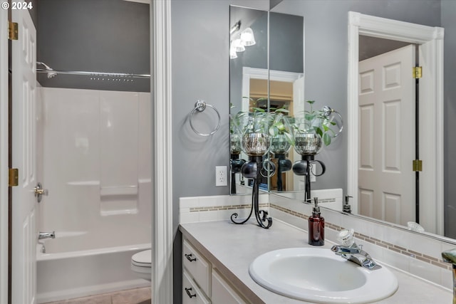 full bathroom featuring  shower combination, vanity, toilet, and tile patterned floors