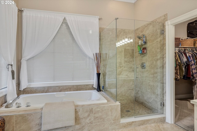 bathroom featuring tile patterned flooring and plus walk in shower