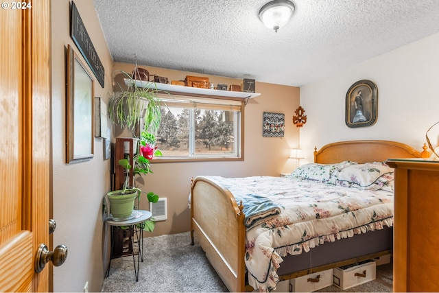 carpeted bedroom with a textured ceiling