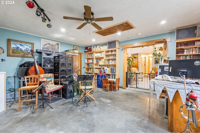 miscellaneous room featuring concrete flooring and ceiling fan