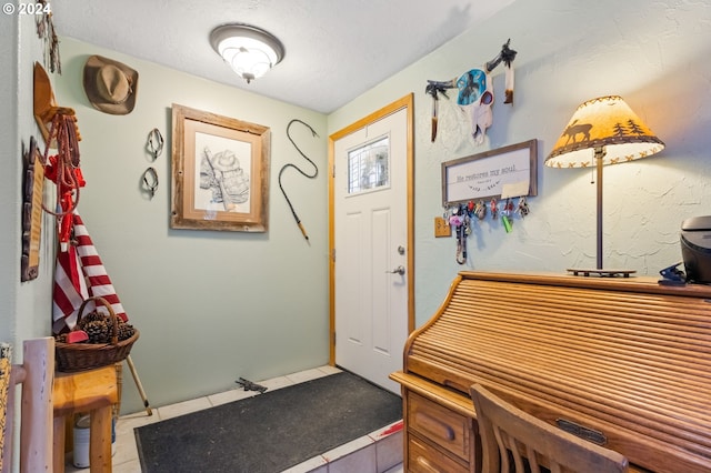 interior space with a textured ceiling