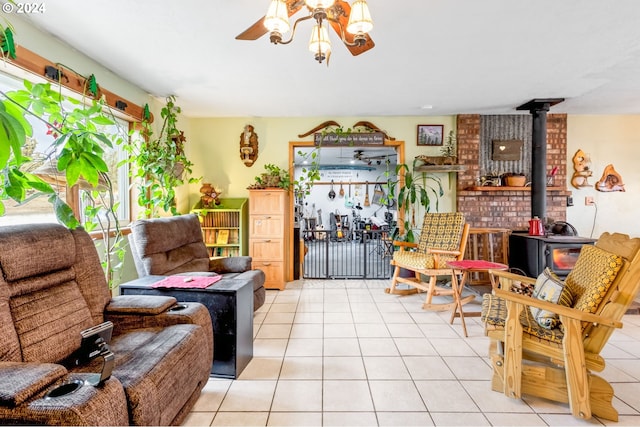 living room featuring a wood stove and light tile patterned floors