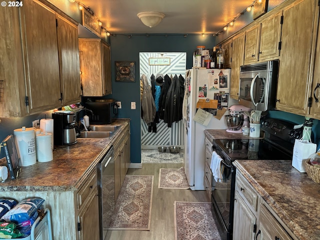 kitchen featuring sink, dark hardwood / wood-style floors, and black appliances