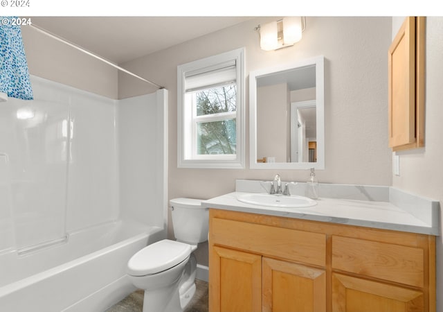 bathroom featuring toilet, tub / shower combination, and vanity