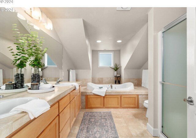 full bathroom with tile patterned floors, vaulted ceiling, toilet, shower with separate bathtub, and vanity