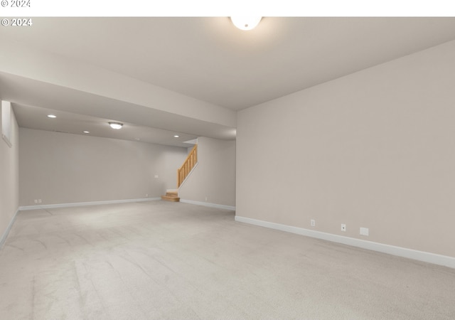 empty room featuring light colored carpet