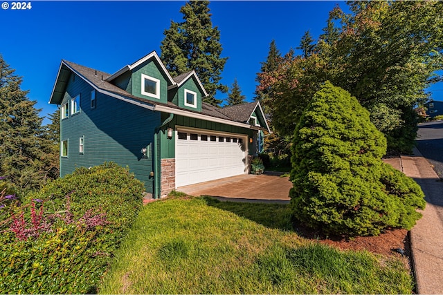 view of property exterior featuring stone siding and driveway