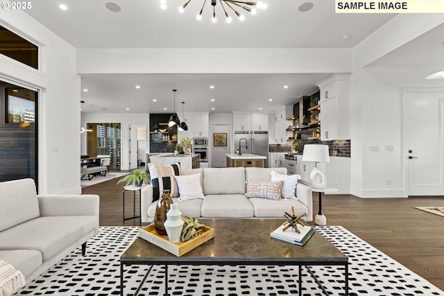 living room featuring a chandelier and dark wood-type flooring