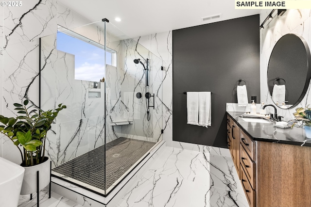 bathroom with vanity and an enclosed shower