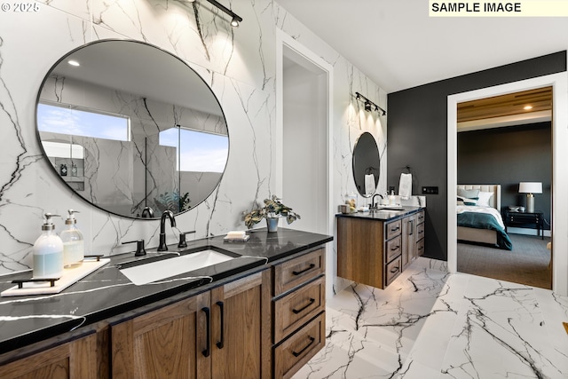 bathroom featuring a shower and vanity