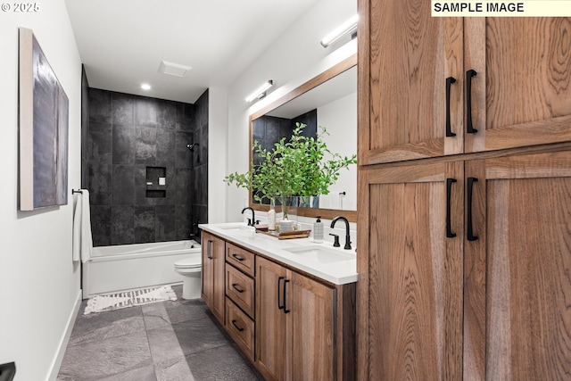 full bathroom with toilet, vanity, and tiled shower / bath