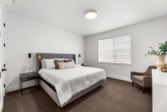 bedroom featuring dark carpet