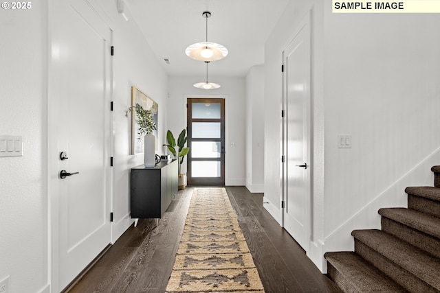 doorway to outside with dark hardwood / wood-style floors