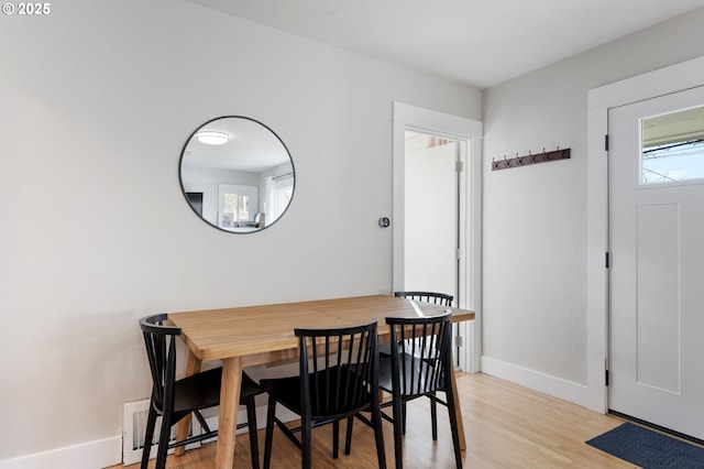 dining room with light hardwood / wood-style flooring