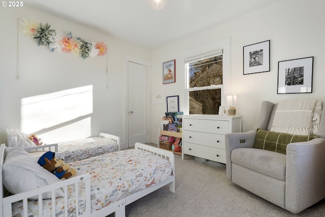 bedroom featuring light colored carpet