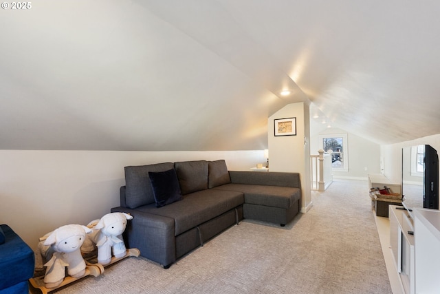 carpeted living room featuring lofted ceiling