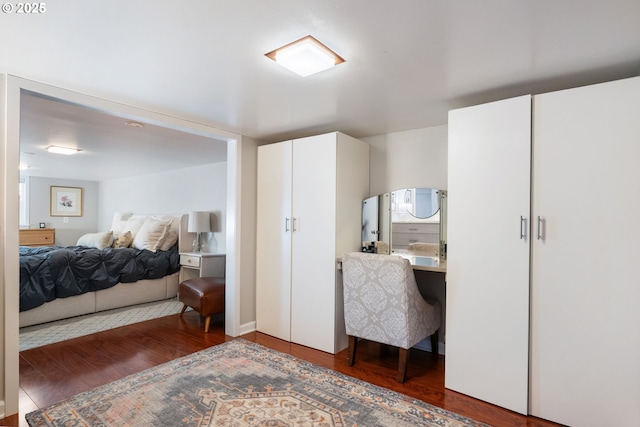 bedroom featuring dark wood-type flooring