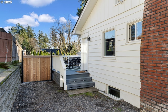 view of home's exterior with a wooden deck