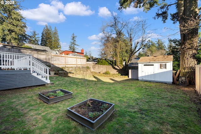 view of yard with a shed and a deck