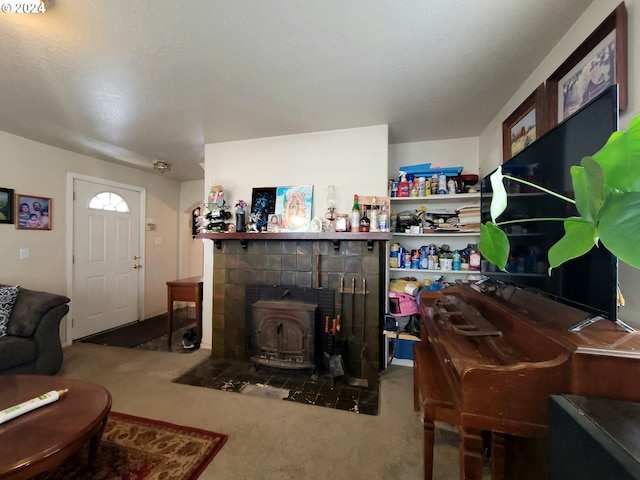 living room with carpet floors and a wood stove