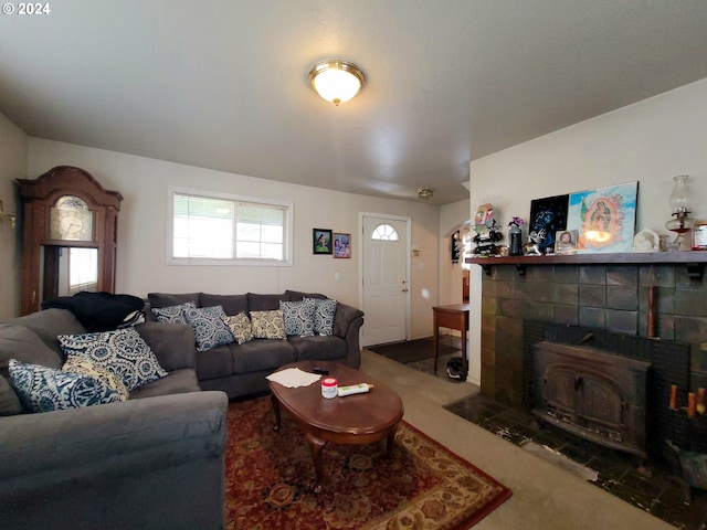 carpeted living room featuring a wood stove