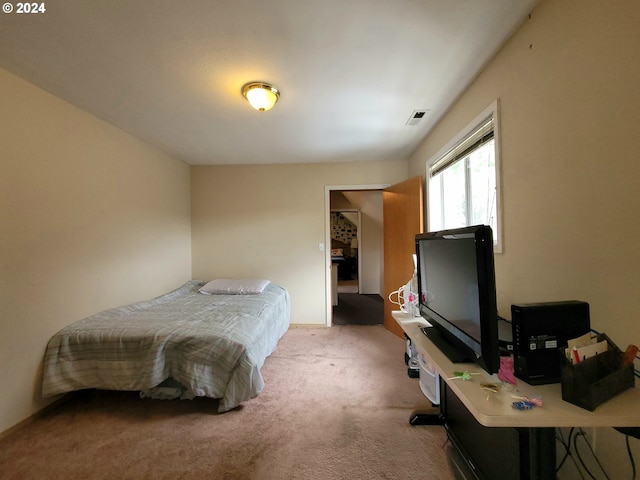 bedroom with light carpet