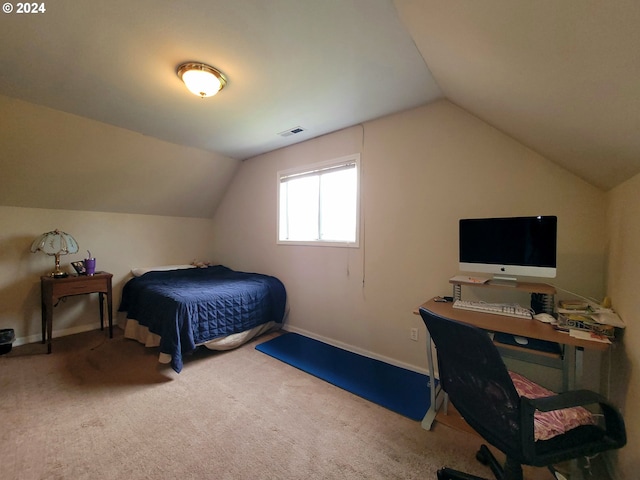 carpeted bedroom featuring lofted ceiling