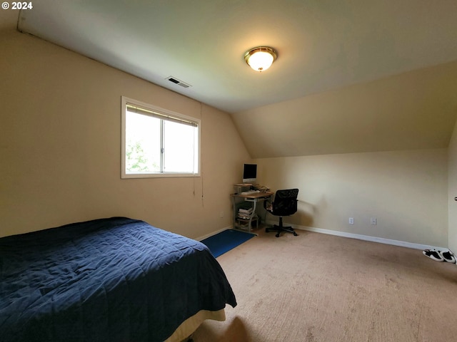 carpeted bedroom featuring vaulted ceiling