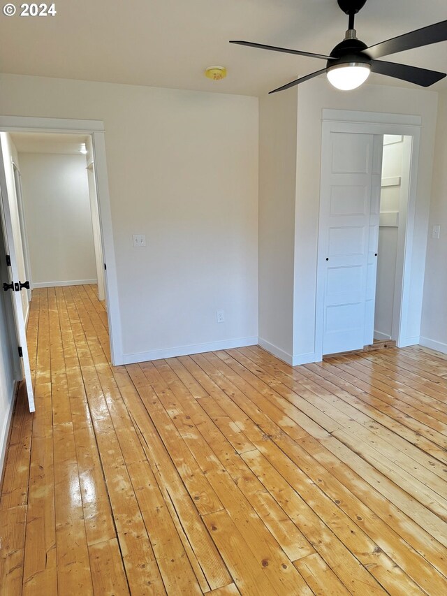 spare room featuring ceiling fan and light wood-type flooring