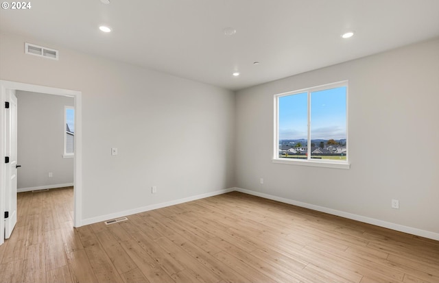 unfurnished room featuring light wood-type flooring