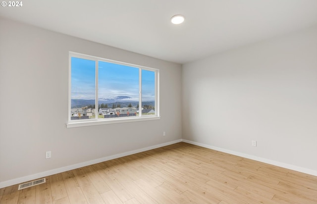 empty room featuring light hardwood / wood-style floors