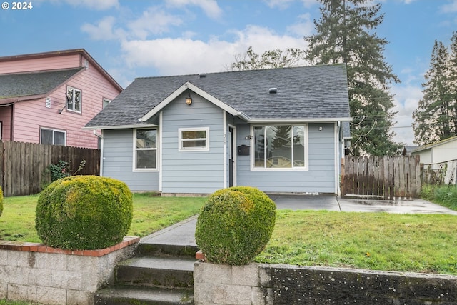 bungalow with a front lawn